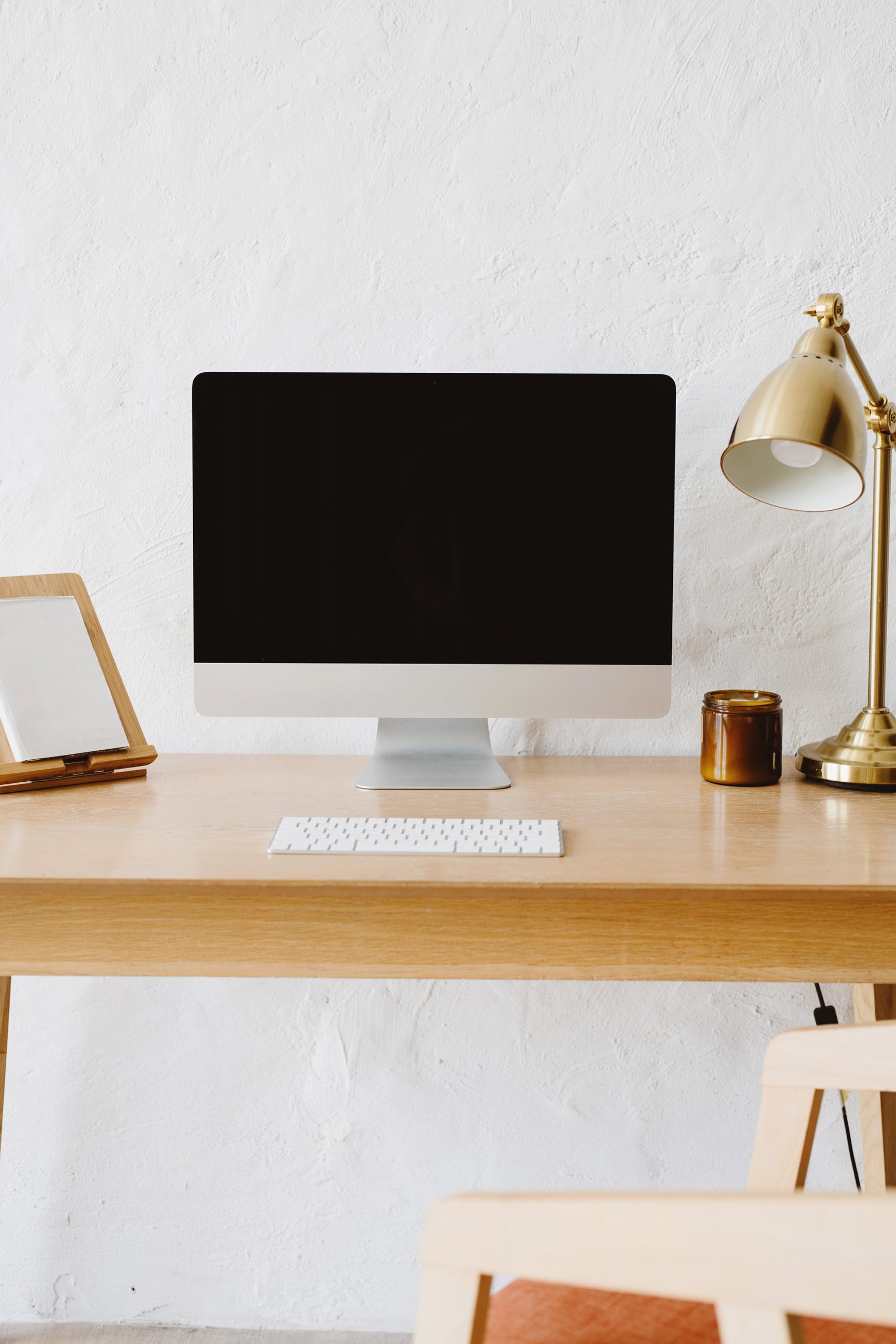 home office with laptop and lamp on desk