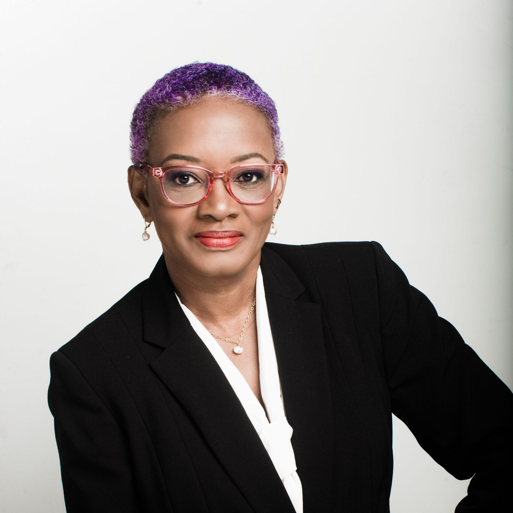 woman in suit taking professional photo