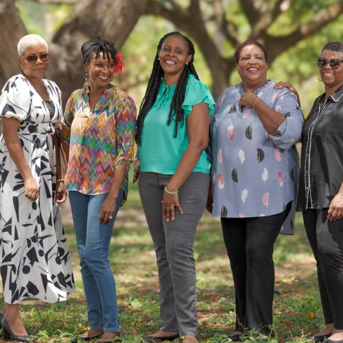 five caribbean virtual assistants standing outdoors